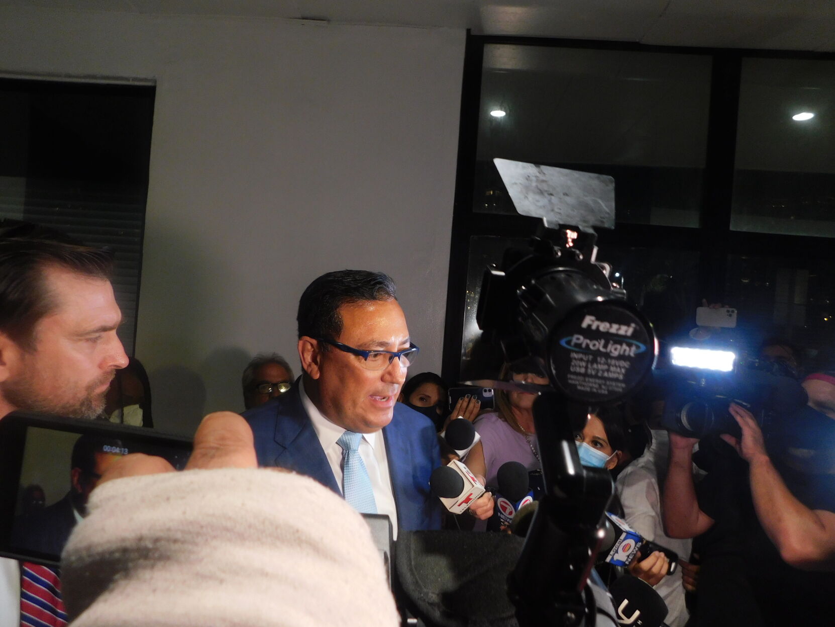 Acevedo swamped by press.JPG